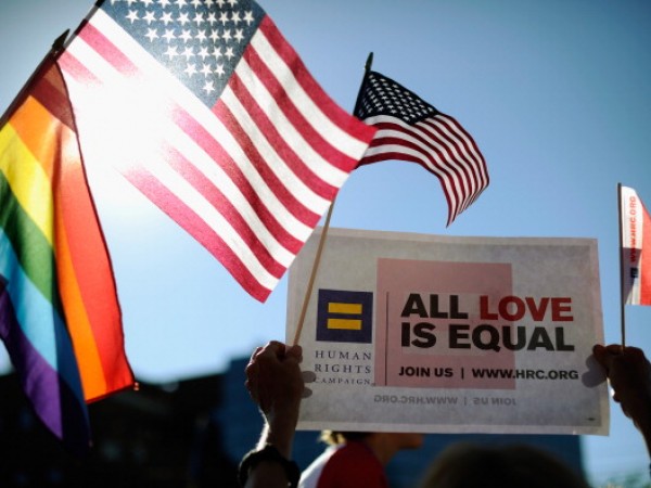 Same-sex marriage supporters celebrate the US Supreme Court ruling during a community rally on June 26, 2013