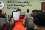 A Colombian immigrant studies ahead of her citizenship exam at the U.S. Citizenship and Immigration Services (USCIS) Queens office on May 30, 2013 in the Long Island City neighborhood of the Queens borough of New York City